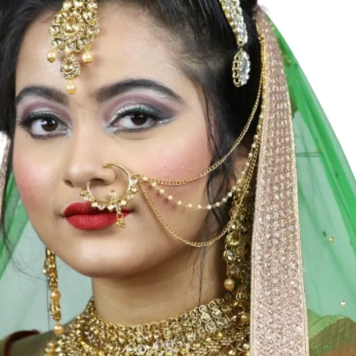 Indian bride with a nose ring and little chain to keep the nose jewelry up Indian bride with a nose ring and little chain to keep the nose jewelry up