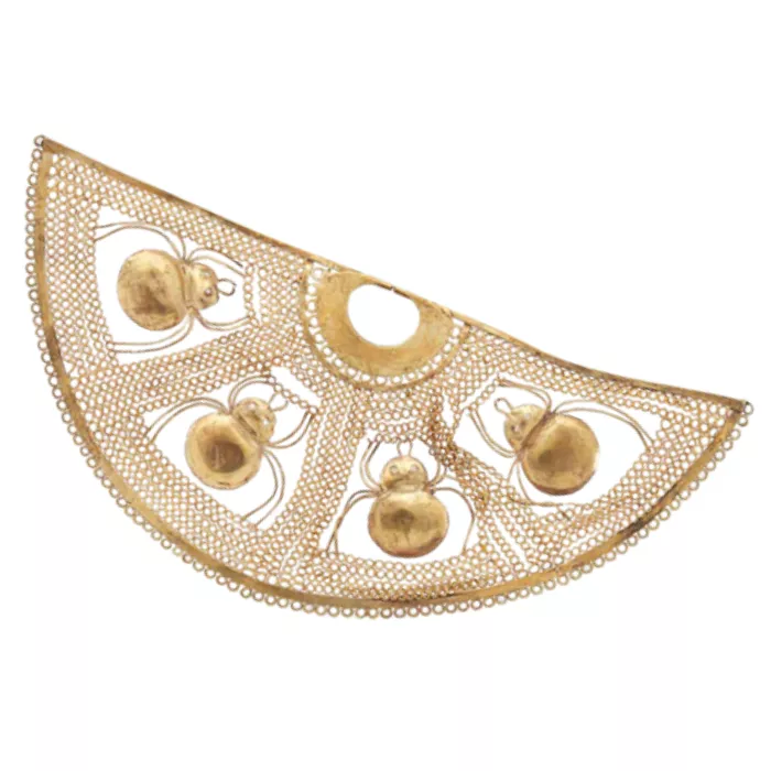 Antique Peruvian golden nose jewelry depicting a spider web. Antique Peruvian golden nose jewelry depicting a spider web.