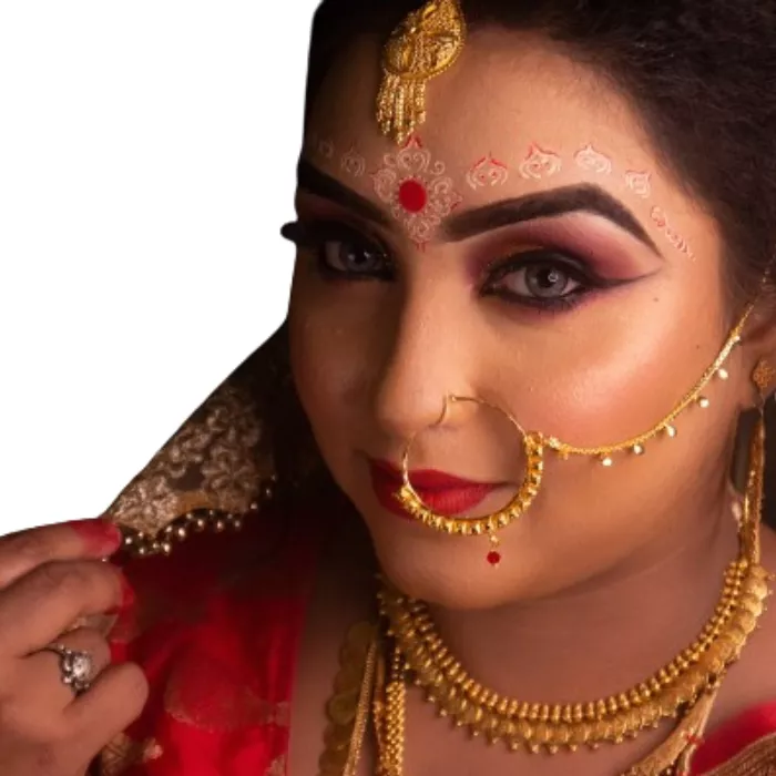 Indian lady wearing a small and larger nose ring. Indian lady wearing a small and larger nose ring.