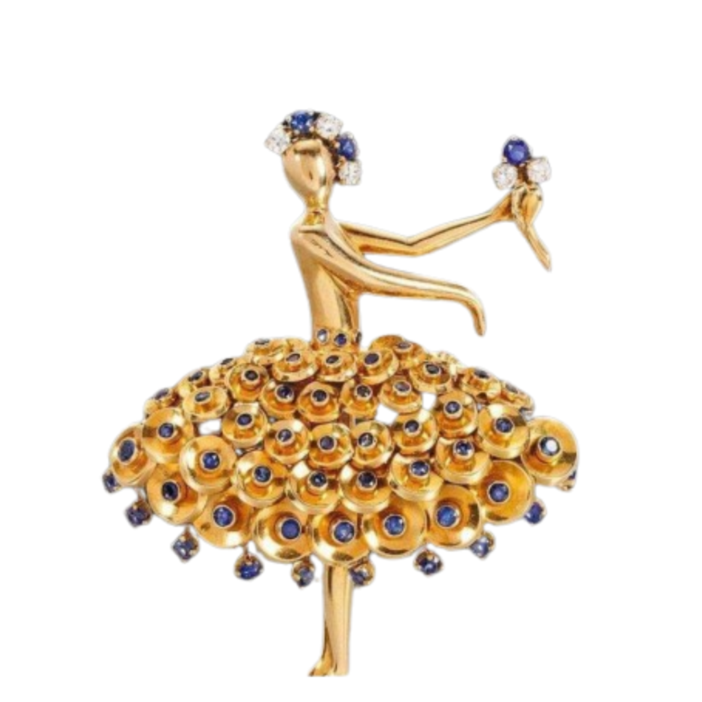 A clip brooch depicting a ballerina, made of gold, sapphires, and diamonds.