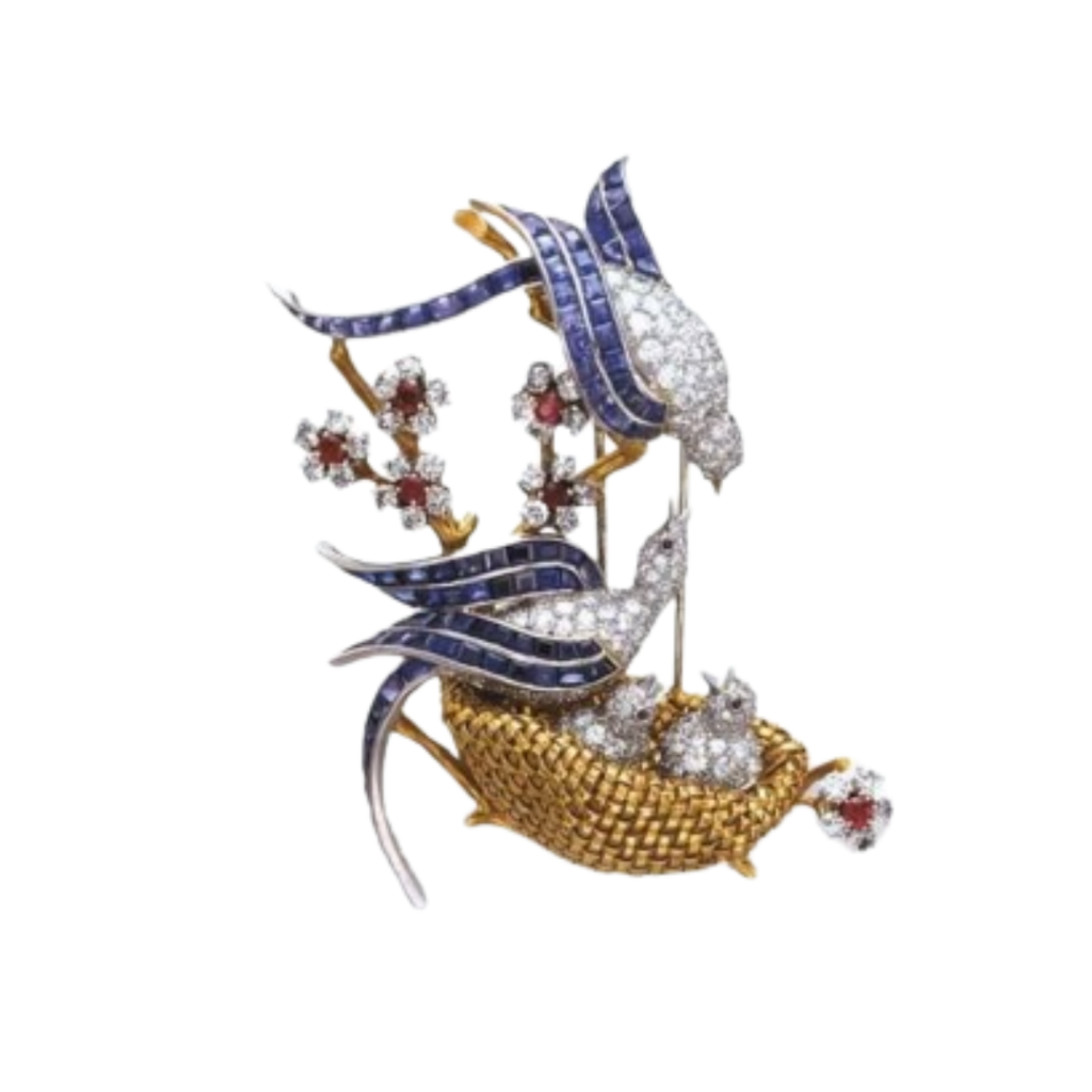 A brooch depicting birds in a nest, made of gold, sapphire, diamonds, and rubies. 